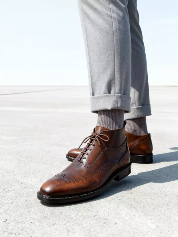 Men's dark brown handcrafted leather brogue boots by Royal Moccs.