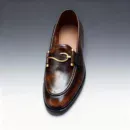 A pair of premium brown leather loafers with a supportive medicated sole for lasting comfort.