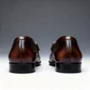 A pair of premium brown leather loafers with a supportive medicated sole for lasting comfort.