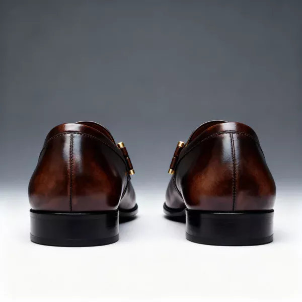 A pair of premium brown leather loafers with a supportive medicated sole for lasting comfort.
