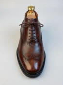 Men's dark brown handcrafted leather brogue boots by Royal Moccs.
