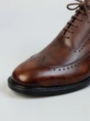 Men's dark brown handcrafted leather brogue boots by Royal Moccs.