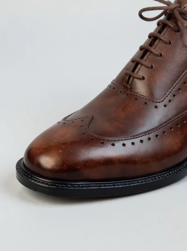 Men's dark brown handcrafted leather brogue boots by Royal Moccs.