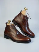 Men's dark brown handcrafted leather brogue boots by Royal Moccs.