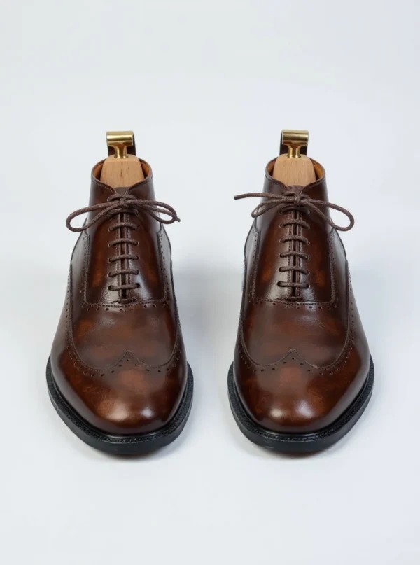 Men's dark brown handcrafted leather brogue boots by Royal Moccs.