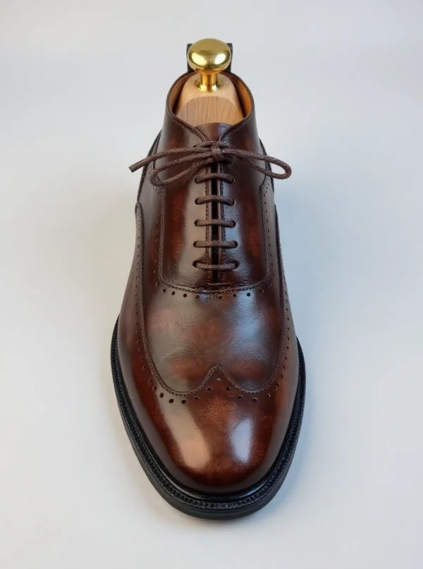 Men's dark brown handcrafted leather brogue boots by Royal Moccs.
