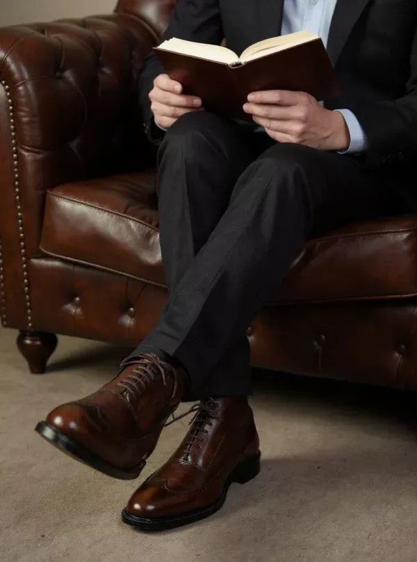 Men's dark brown handcrafted leather brogue boots by Royal Moccs.