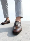 Men's dark brown handcrafted leather loafers with royal crest by Royal Moccs.