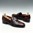Men's dark brown handcrafted leather loafers with royal crest by Royal Moccs.