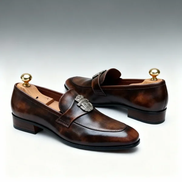 Men's dark brown handcrafted leather loafers with royal crest by Royal Moccs.