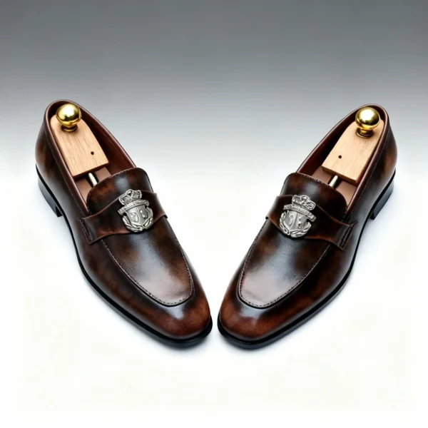 Men's dark brown handcrafted leather loafers with royal crest by Royal Moccs.