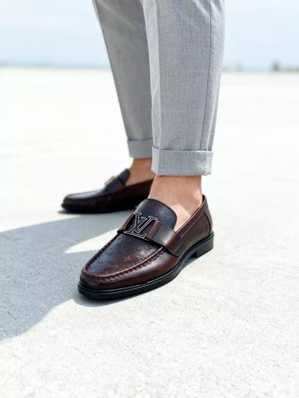 Stylish embossed leather shoes for men with silver hardware, available to buy online in Pakistan.