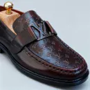 Stylish embossed leather shoes for men with silver hardware, available to buy online in Pakistan.