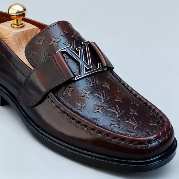 Stylish embossed leather shoes for men with silver hardware, available to buy online in Pakistan.