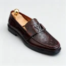 Stylish embossed leather shoes for men with silver hardware, available to buy online in Pakistan.