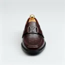 Stylish embossed leather shoes for men with silver hardware, available to buy online in Pakistan.