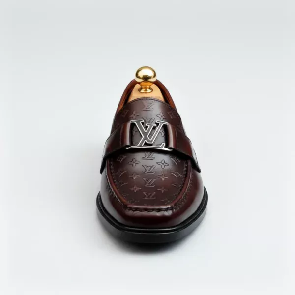 Stylish embossed leather shoes for men with silver hardware, available to buy online in Pakistan.