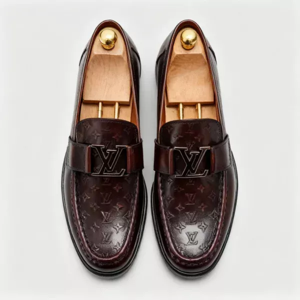 Stylish embossed leather shoes for men with silver hardware, available to buy online in Pakistan.
