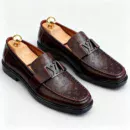 Stylish embossed leather shoes for men with silver hardware, available to buy online in Pakistan.