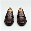 Stylish embossed leather shoes for men with silver hardware, available to buy online in Pakistan.