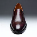 Men's brown handcrafted leather loafers with decorative stitching by Royal Moccs.