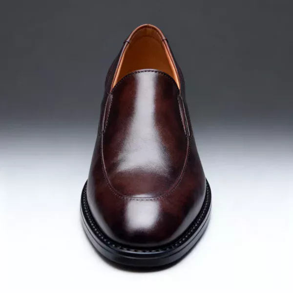 Men's brown handcrafted leather loafers with decorative stitching by Royal Moccs.