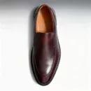 Men's brown handcrafted leather loafers with decorative stitching by Royal Moccs.