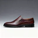 Men's brown handcrafted leather loafers with decorative stitching by Royal Moccs.