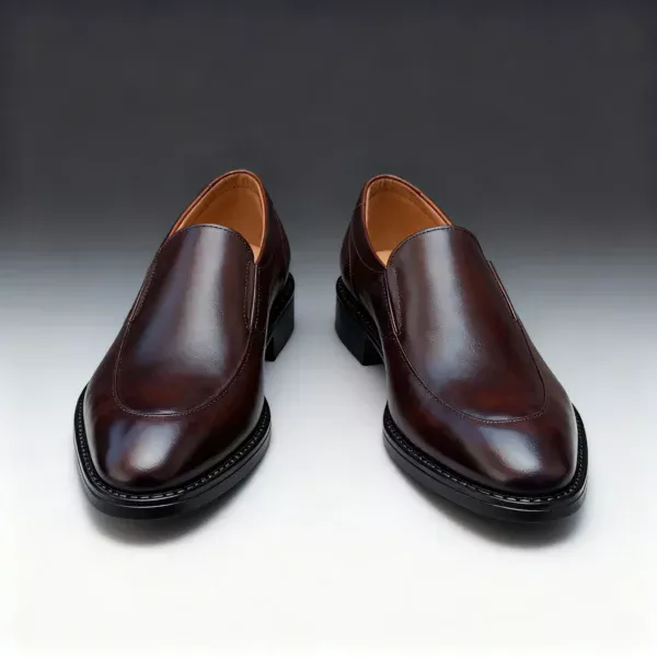 Men's brown handcrafted leather loafers with decorative stitching by Royal Moccs.