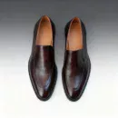 Men's brown handcrafted leather loafers with decorative stitching by Royal Moccs.