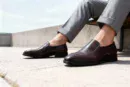Men's brown handcrafted leather loafers with decorative stitching by Royal Moccs.