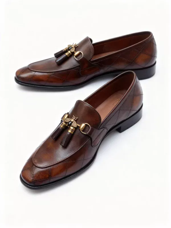 A pair of premium brown leather quilted loafers with a supportive medicated sole for lasting comfort.