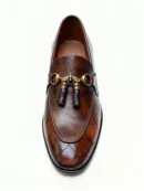 A pair of premium brown leather quilted loafers with a supportive medicated sole for lasting comfort.