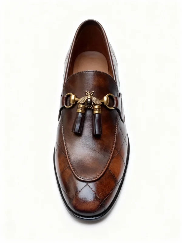 A pair of premium brown leather quilted loafers with a supportive medicated sole for lasting comfort.