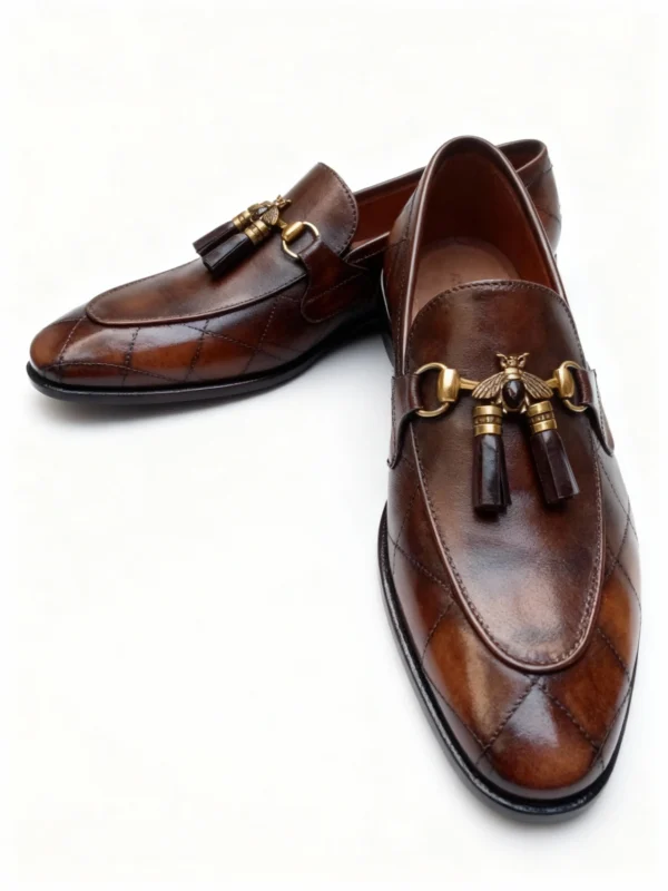 A pair of premium brown leather quilted loafers with a supportive medicated sole for lasting comfort.