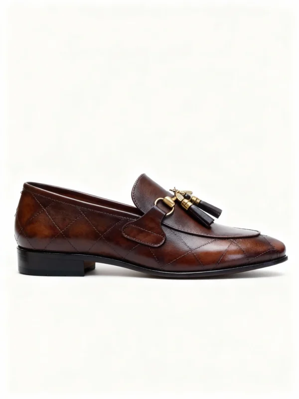 A pair of premium brown leather quilted loafers with a supportive medicated sole for lasting comfort.