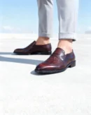 A pair of premium brown leather shoes with a supportive medicated sole for lasting comfort.