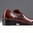 A pair of premium brown leather shoes with a supportive medicated sole for lasting comfort.