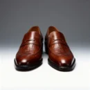 A pair of premium brown leather shoes with a supportive medicated sole for lasting comfort.