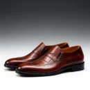 A pair of premium brown leather shoes with a supportive medicated sole for lasting comfort.