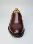 Men's brown handcrafted leather loafers with decorative stitching by Royal Moccs.