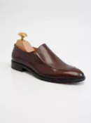 Men's brown handcrafted leather loafers with decorative stitching by Royal Moccs.