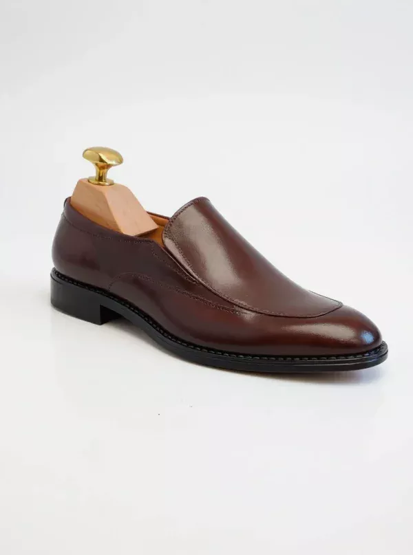 Men's brown handcrafted leather loafers with decorative stitching by Royal Moccs.