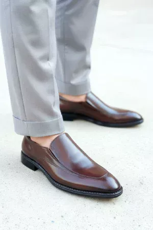Men's brown handcrafted leather loafers with decorative stitching by Royal Moccs.