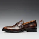 Men's dark brown handcrafted leather single strap loafers by Royal Moccs.