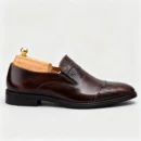 Stylish formal loafers for men with silver insignia, available to buy online in Pakistan.