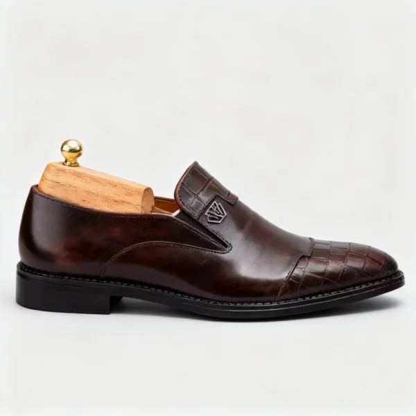 Stylish formal loafers for men with silver insignia, available to buy online in Pakistan.