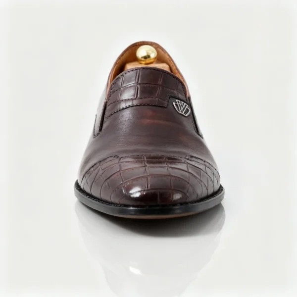 Stylish formal loafers for men with silver insignia, available to buy online in Pakistan.
