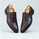 Stylish formal loafers for men with silver insignia, available to buy online in Pakistan.