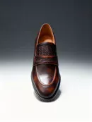 Men's brown handcrafted leather loafers with woven saddle by Royal Moccs.